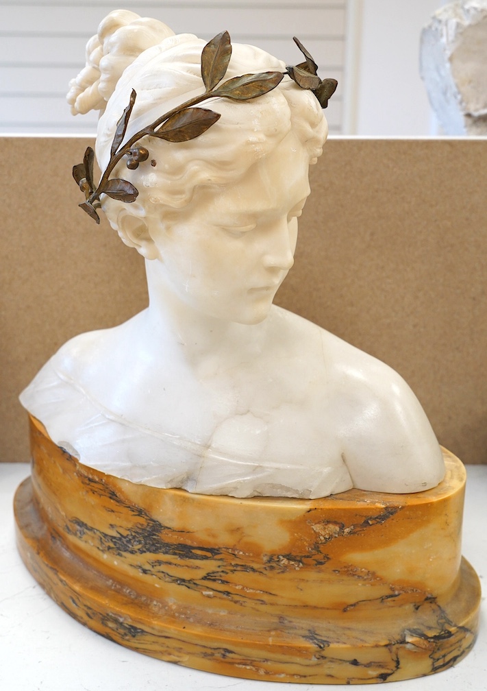 An early 20th century alabaster bust of 'Victory', on marble base, 43cm. Condition - poor to fair